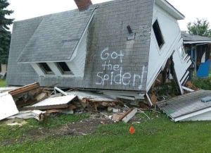 spider phobia treatment - image of destroyed house lying on it's side with the words "got the spider" written in large letters on the roof.