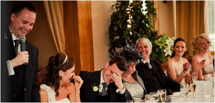 fear of public speaking hypnotherapy - successful speaker at wedding top table with people laughing